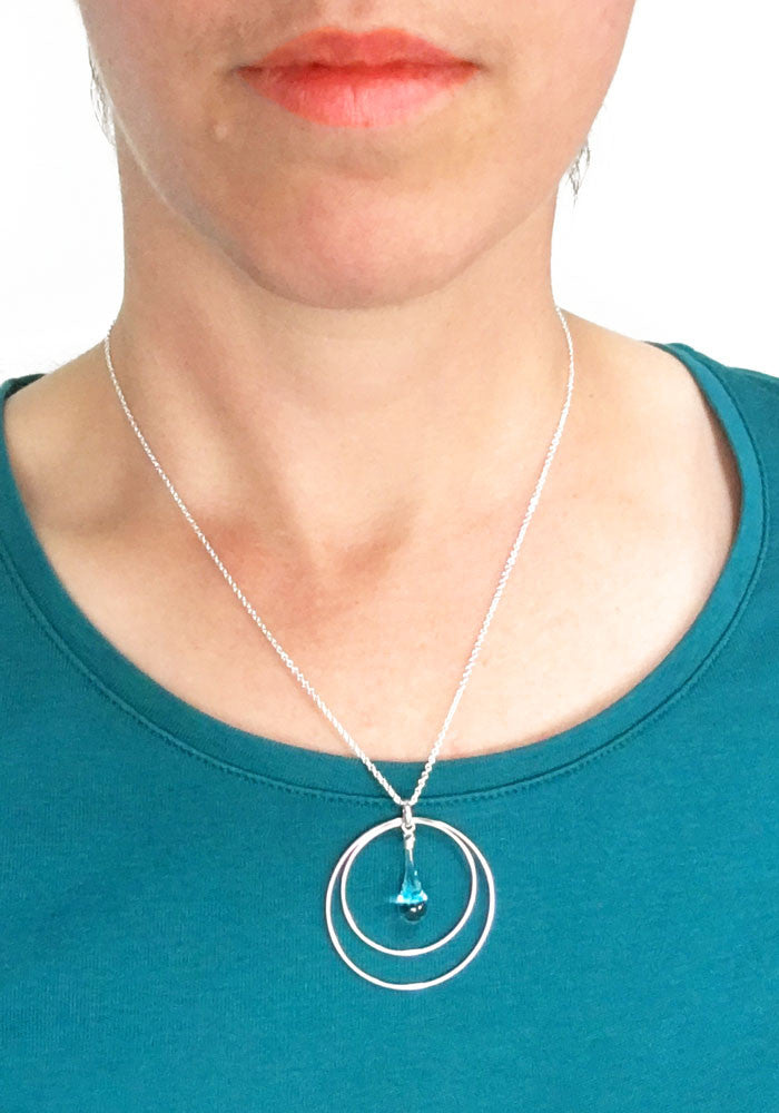 Aqua Tornado Eclipse Pendant Necklace - glass Necklace by Sundrop Jewelry